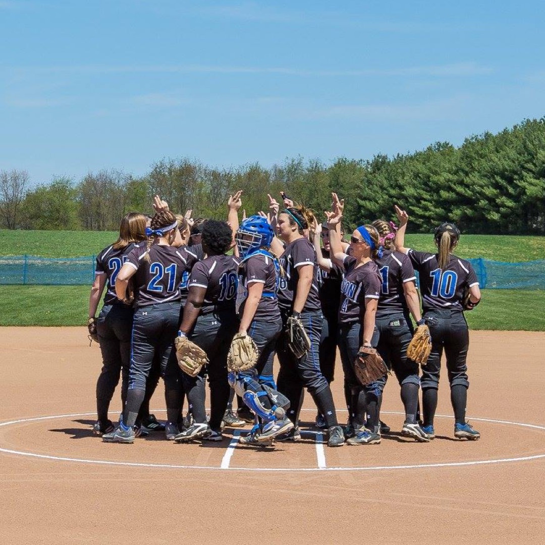 Girls softball team in huddle